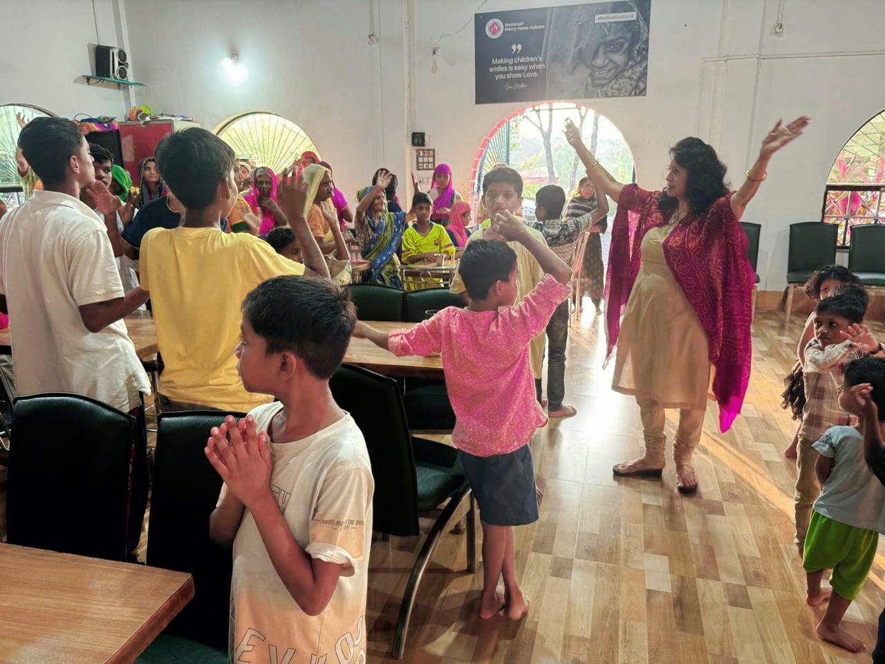 Kadambari dancing and celebrating with children